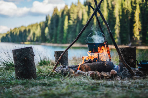 How to Set Up and Use a Tripod Grill Over a Campfire