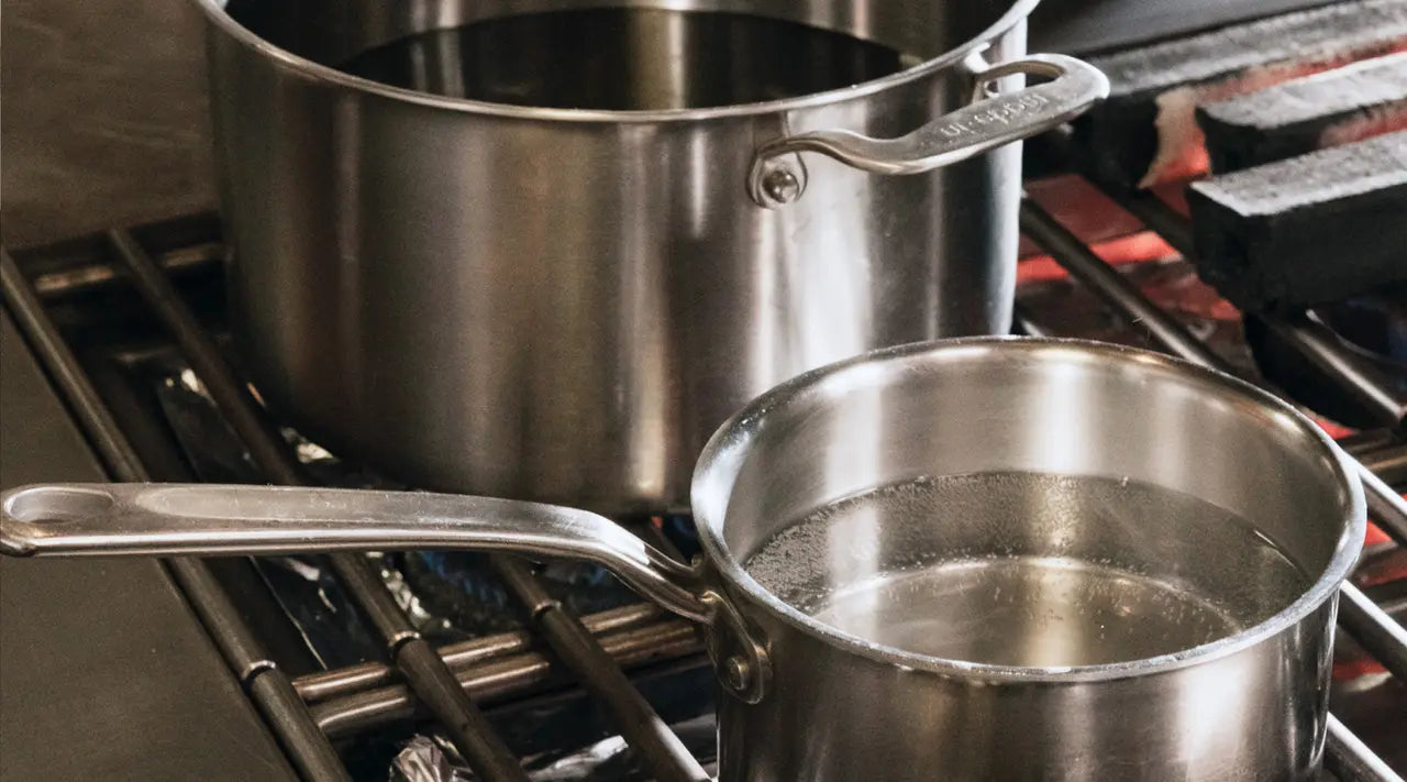 What is the Correct Way to Lift the Lid Off a Saucepan?